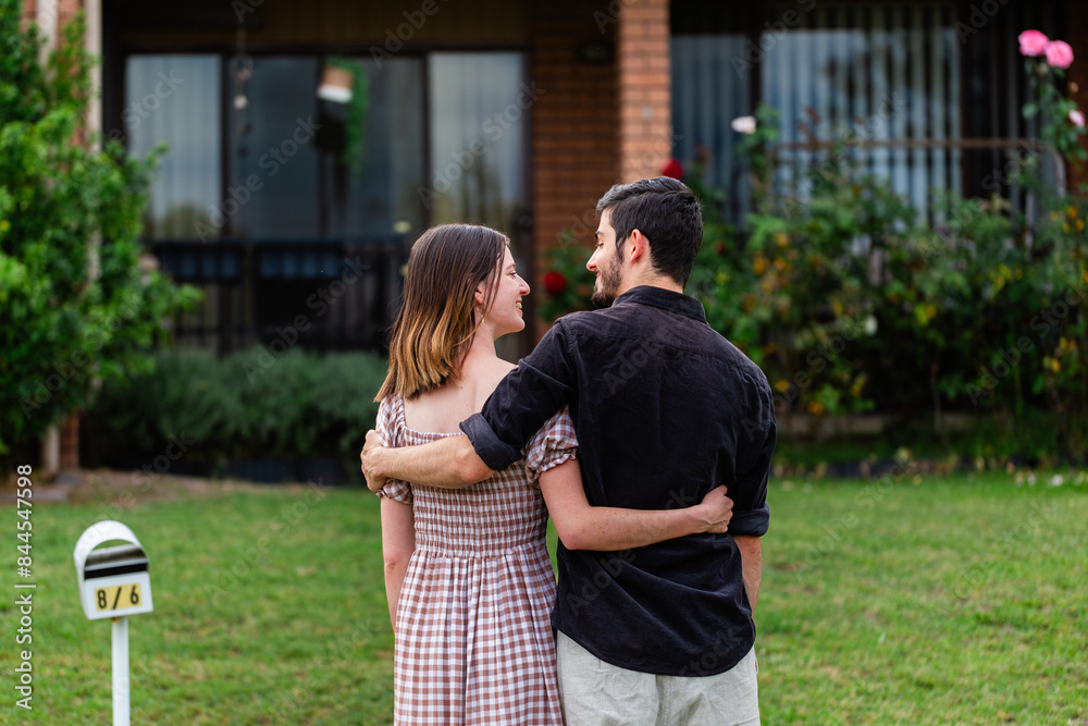 Young first home buyers looking at home happy to make purchase Young first home buyers looking at home happy to make purchase