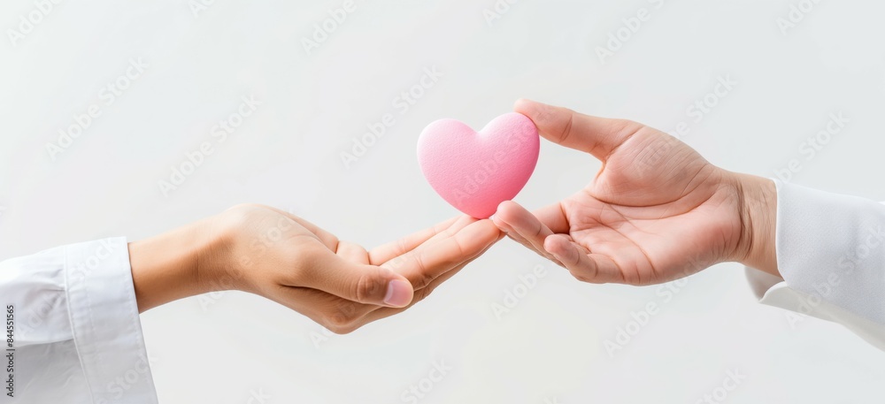 Two hands passing a soft pink heart to each other on a white background, representing kindness, love, and human connection in a clean, minimalistic style. Two hands passing a soft pink heart to each other on a white background, representing kindness, love, and human connection in a clean, minimalistic style.