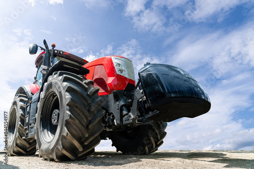 Modern red agricultural tractor bottom view.