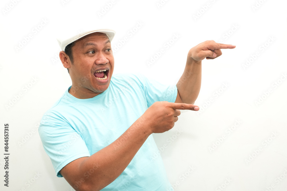 Adult Asian man shocked gesture with his right hand pointing to the side Adult Asian man shocked gesture with his right hand pointing to the side