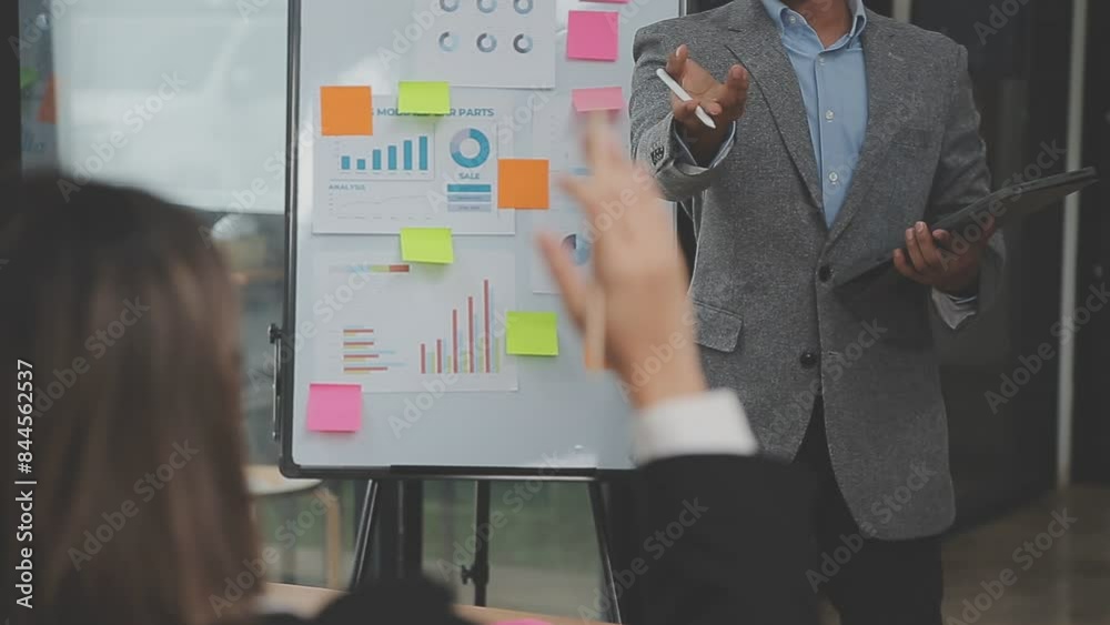 Financial analysts analyze business financial reports on a digital tablet planning investment project during a discussion at a meeting of corporate showing the results of their successful teamwork.