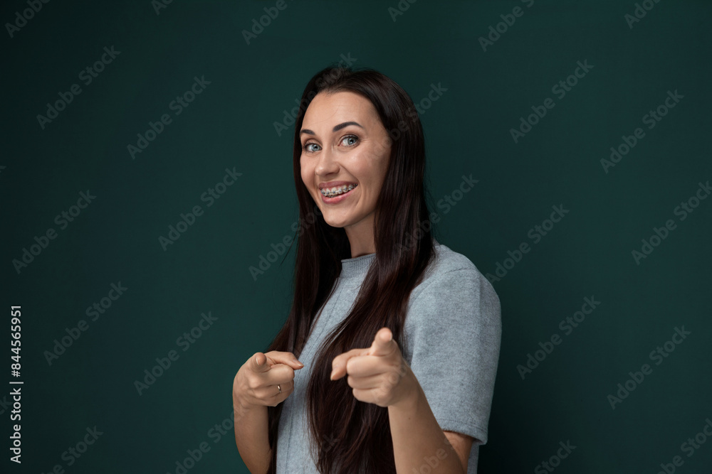 Woman With Long Black Hair Pointing at Camera Woman With Long Black Hair Pointing at Camera