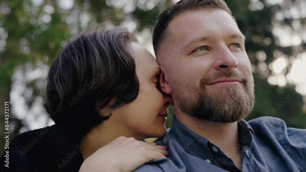 A heartwarming moment as a woman rests her head on a man's shoulder outdoors, showcasing intimacy and affection. Loving Couple Embracing Outdoors Amidst Nature and Serenity A heartwarming moment as a woman rests her head on a man's shoulder outdoors, showcasing intimacy and affection. Loving Couple Embracing Outdoors Amidst Nature and Serenity