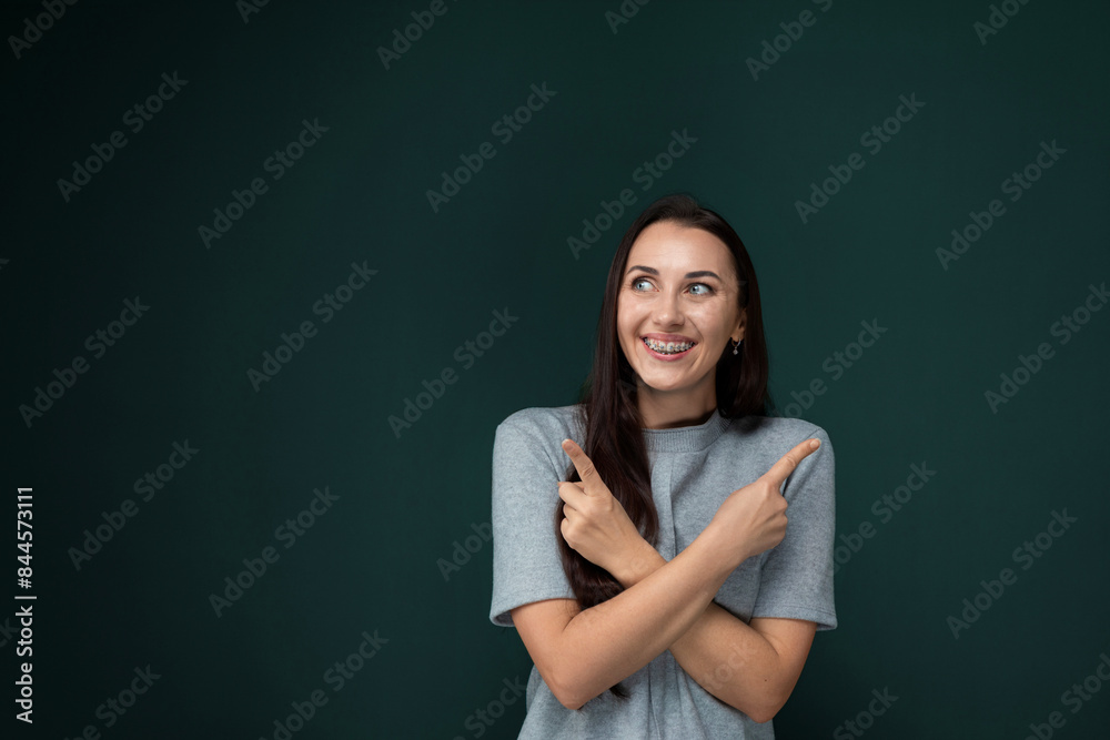 Woman Standing in Front of Green Wall Woman Standing in Front of Green Wall