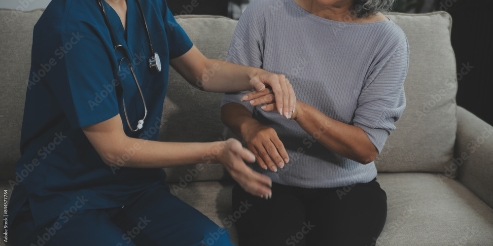 Female caregiver doing regular check-up of senior woman in her home. Female caregiver doing regular check-up of senior woman in her home.