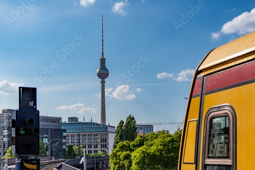 Canvas Print Yellow Berlin metro train on a sunny day. Berlin yellow train.