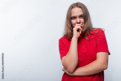 Cute teen girl puzzled by a thought