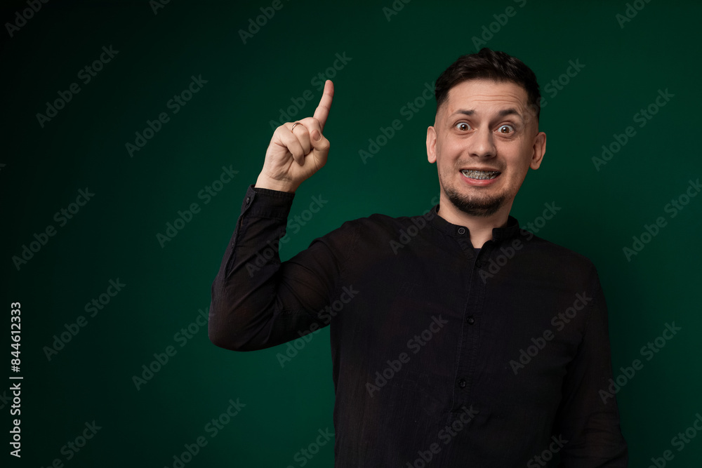 Man in Black Shirt Pointing at Something Man in Black Shirt Pointing at Something