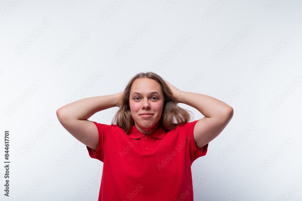 Funny girl with brown hair laughs loudly and holds her head Funny girl with brown hair laughs loudly and holds her head