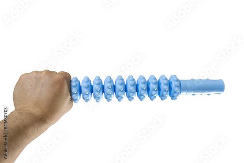 A man's hand holds a blue plastic roller massager for muscle relaxation isolated on white background. Anti cellulite therapy, deep tissue massage and spa treatment concept