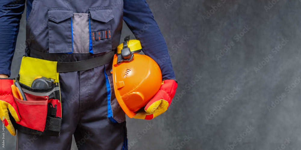 Fototapeta premium Builder in personal protective equipment. Panoramic banner with copy space.
