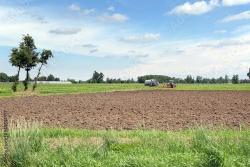 terreno agricolo con trattori, agricultural land with tractors photo