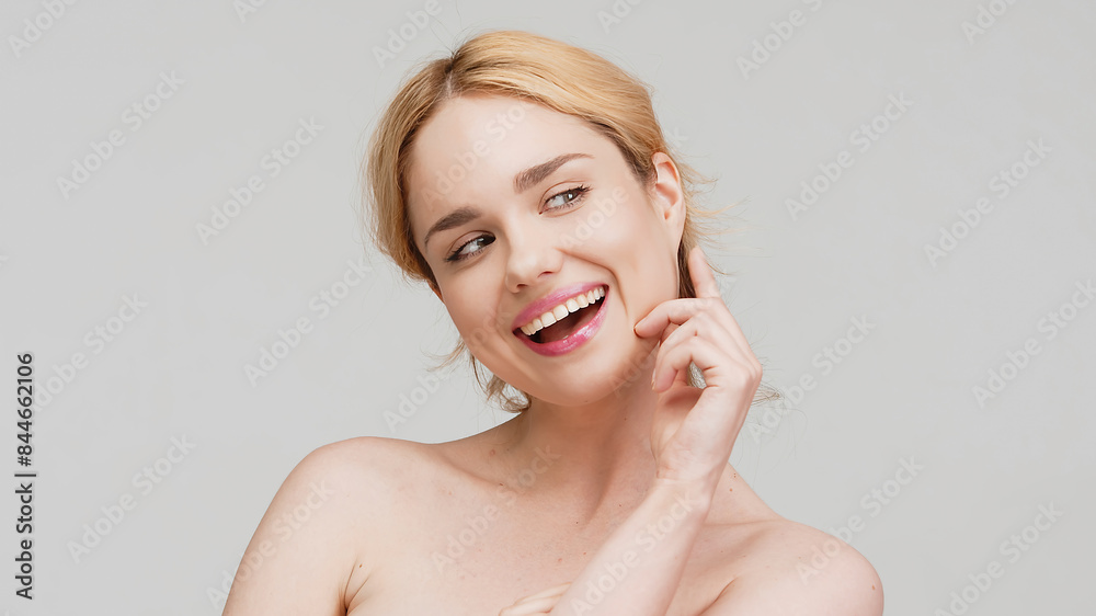 High-quality portrait of skincare and cosmetics concept with copy space for text. Woman with beautiful face touching healthy facial skin. Beautiful smile with healthy white teeth, clear glowing skin. High-quality portrait of skincare and cosmetics concept with copy space for text. Woman with beautiful face touching healthy facial skin. Beautiful smile with healthy white teeth, clear glowing skin.