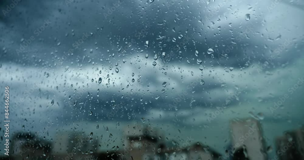 Raindrops on Wet Window Glass. Rain Clouds Storm Sky Background. Rainy Weather in City. 4K 10-bit 60 fps