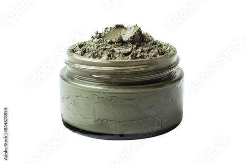 Glass jar filled with green clay mask for skincare, isolated on white background. Natural beauty product for healthy and radiant skin. photo