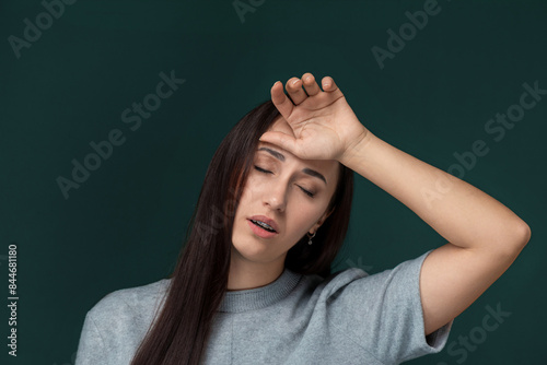 Woman Holding Her Head in Her Hands