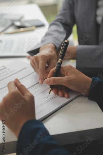 Business Signing a Contract Buy - sell house, insurance agent analyzing about home investment loan Real Estate concept.