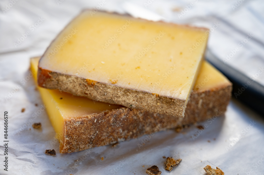 French cheese Comte, varieties unpasteurised ed milk Prestige, fruity flavoured Fruite and Vieille Reserve close up French cheese Comte, varieties unpasteurised ed milk Prestige, fruity flavoured Fruite and Vieille Reserve close up