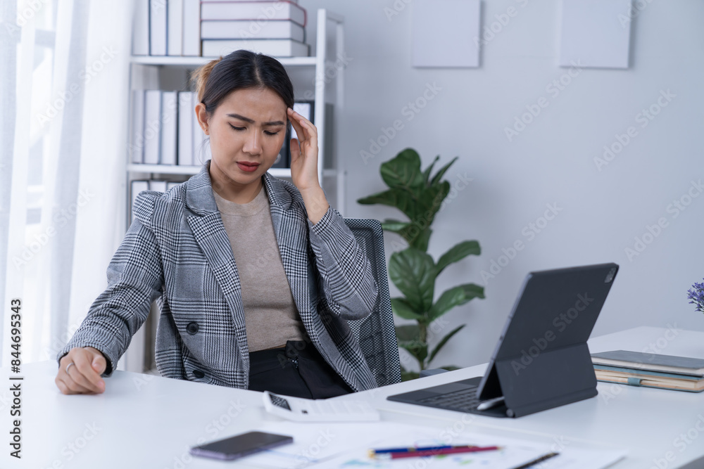 Bussiness women using laptop and smartphone working in the office Bussiness women using laptop and smartphone working in the office