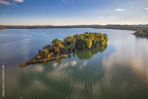 Aerial view of Pusiano Lake and Isola dei Cipressi, in Como, Lombardy, Italy photo