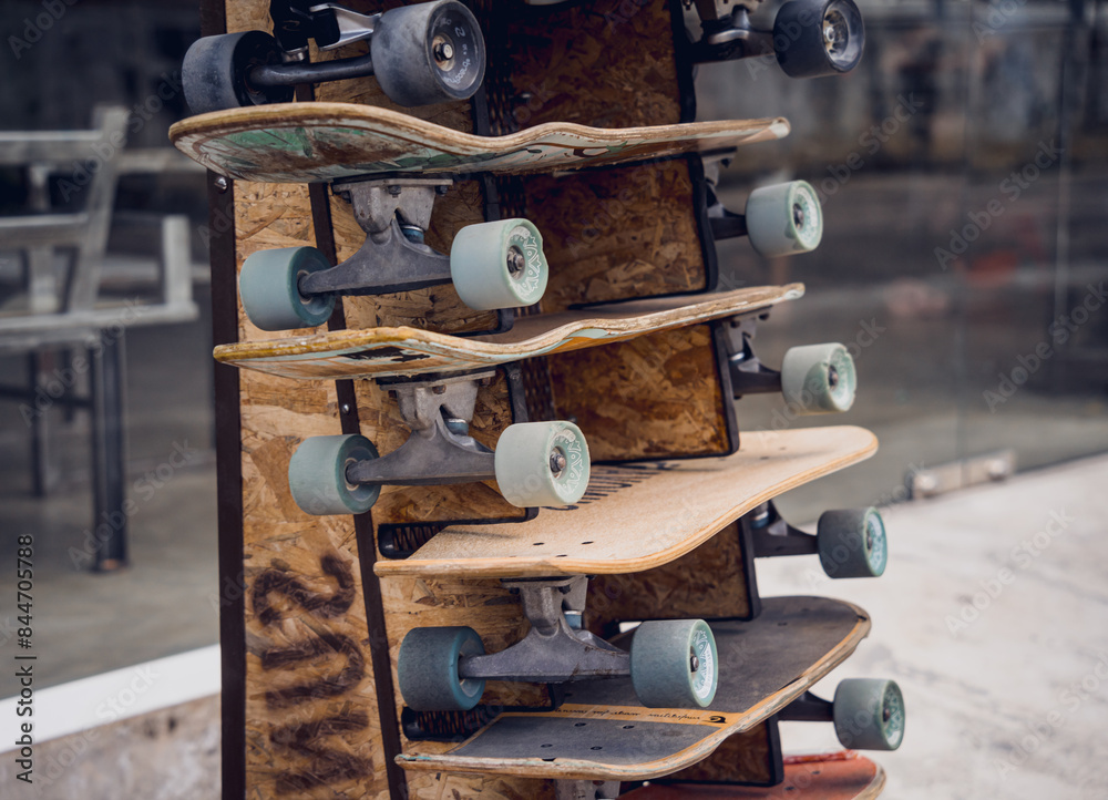 A stack of skateboards on a special outdoor stand