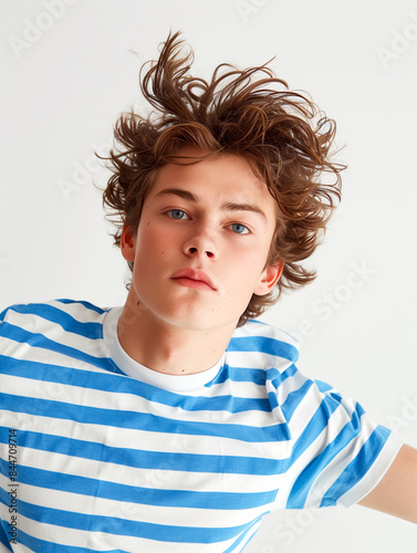 Model wearing blue and white striped short sleeved tshirt, nautical theme. photo