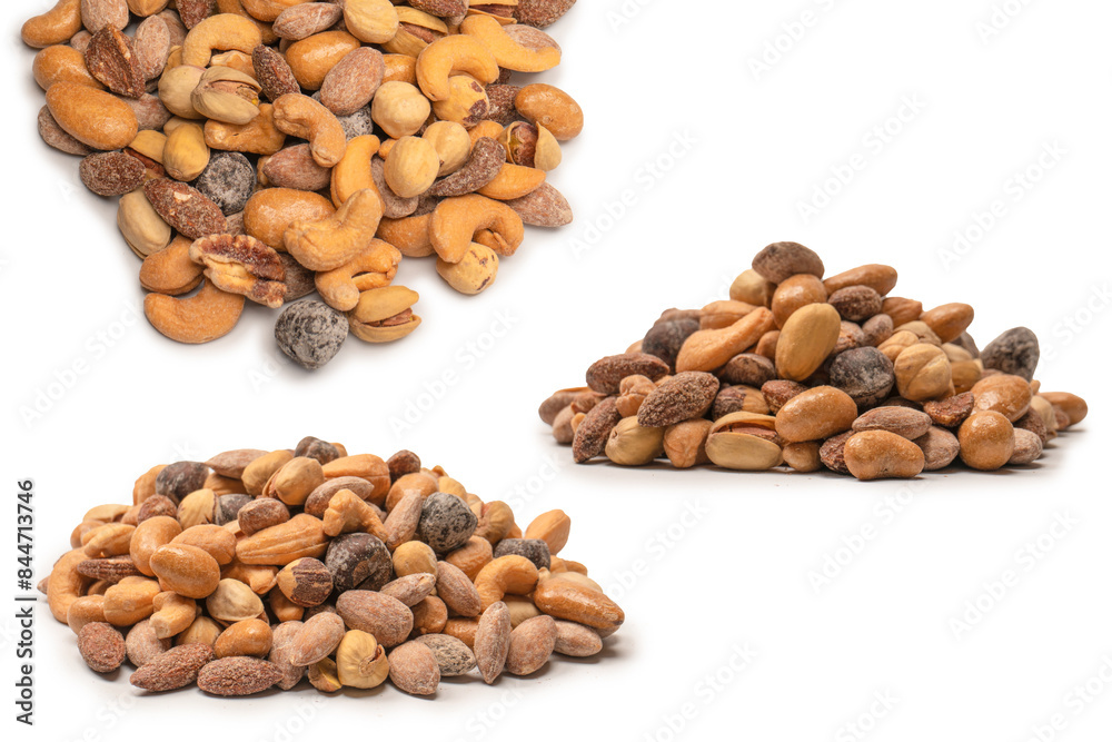 A group of almonds, pistachios, walnuts, macadamia, cashews. A group of almonds, pistachios, walnuts, macadamia, cashews.
