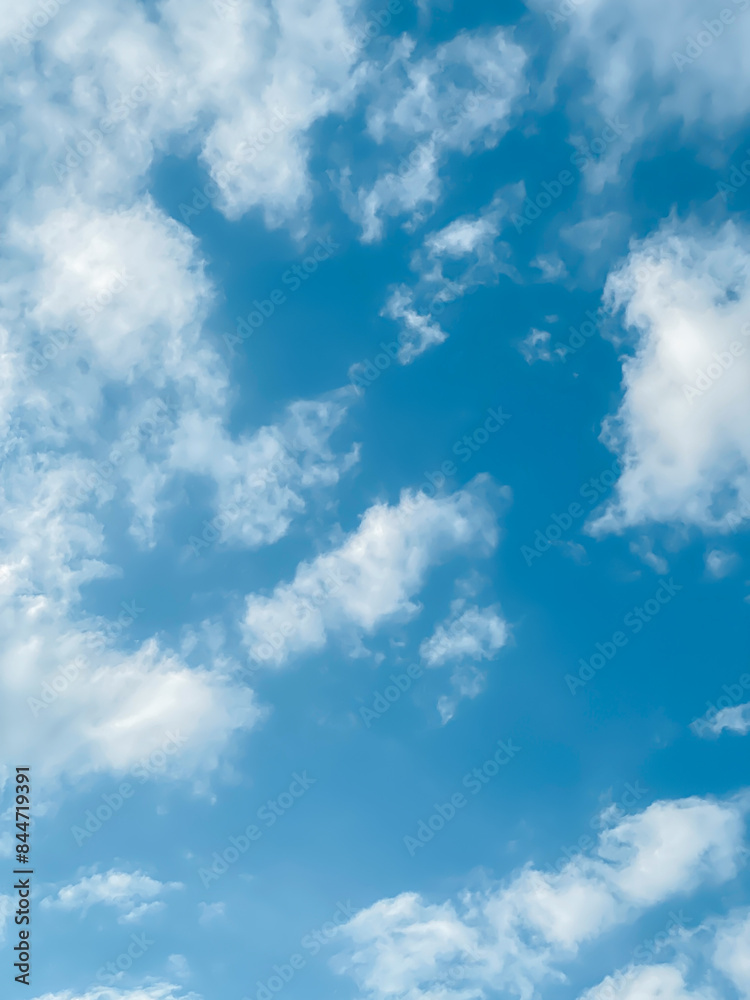 Obraz premium Sky and fluffy cloud scenery in the morning is incredibly calming to start the day,sky and fluffy white cloud made me feel relaxed,sky and fluffy cloud scenery take a majestic and breathtaking beauty