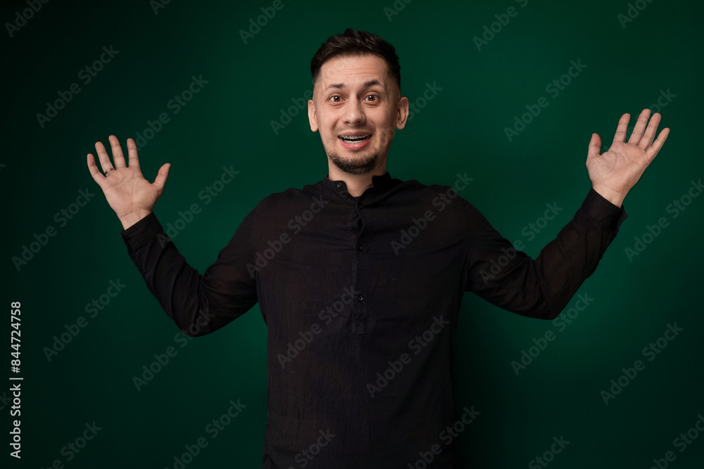 Man Standing in Front of Green Background Man Standing in Front of Green Background