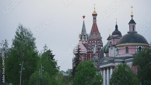 Kremlin and Saint Basil's Cathedral View Among the Trees in Park Zaryadye Durning Summer in Moscow