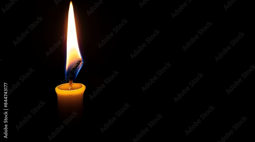 A solitary candle stands in the dark, its center bearing another candle, while a third candle juts out from its side A solitary candle stands in the dark, its center bearing another candle, while a third candle juts out from its side