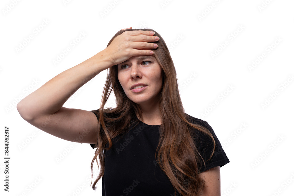 Fototapeta premium Puzzled young woman with straight brown hair is excited and worried