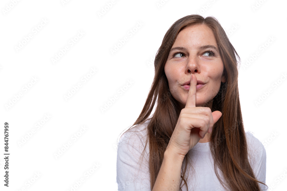 Young woman keeping a secret and covering her mouth with her finger Young woman keeping a secret and covering her mouth with her finger