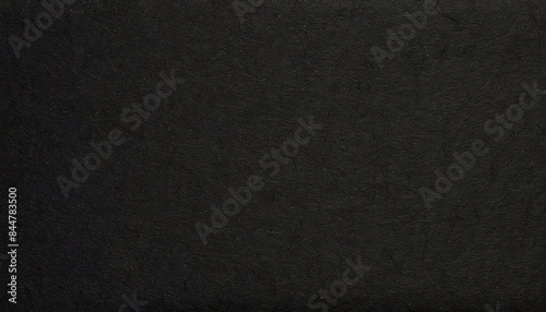 Dark, dusty, grainy, rough, earthy handmade black paper texture with visible fibers, for minimalistic art or backgrounds.