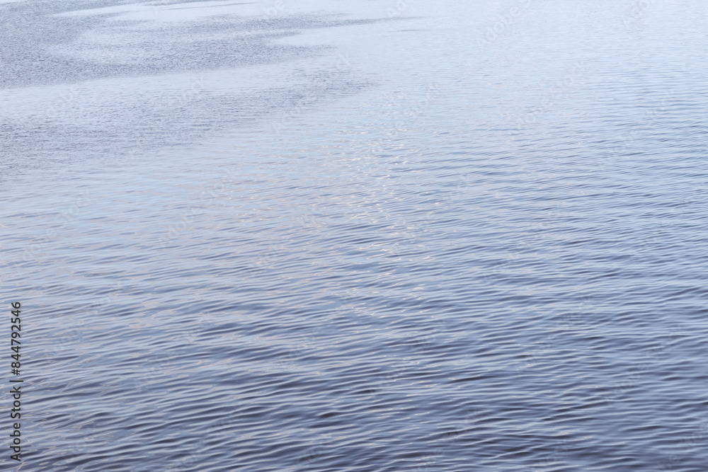 Sparkling blue water with small waves in it
Sparkling blue water with small waves in it