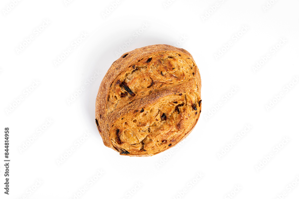 A loaf of sourdough bread with sun-dried tomato A loaf of sourdough bread with sun-dried tomato