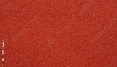 Dusty, grainy, rough, earthy red paper texture with visible fibers, for minimalistic art or backgrounds.