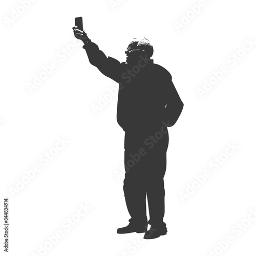 Silhouetted Man Holding Phone Aloft: Modern Observation