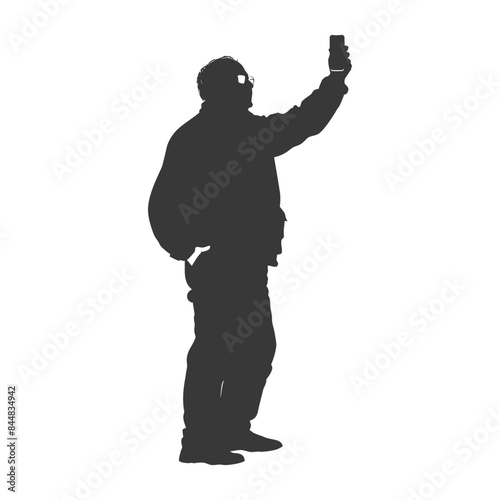 Silhouette: Man in Glasses Takes Selfie with Phone Held High, Side View.