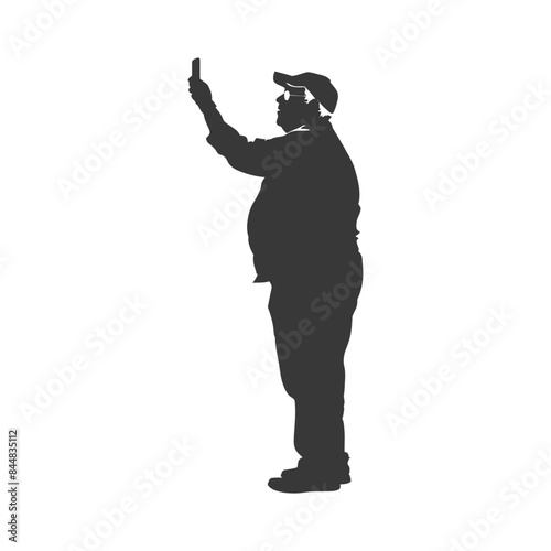 Silhouette of a Man in Cap Taking a Selfie.