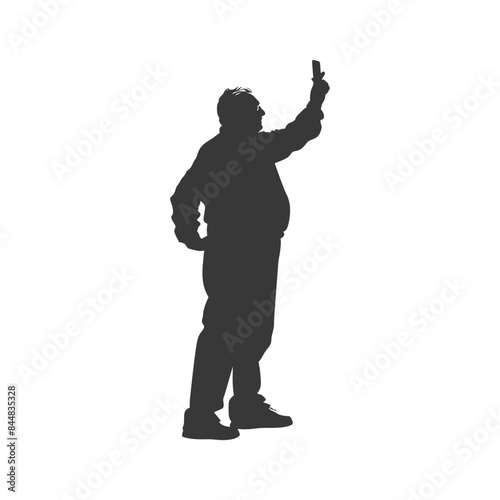 Silhouette of portly man taking a selfie with raised phone.