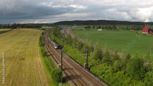Wallpaper Mural Airport High speed train - Oslo - Norway - aerial low altitude scene / train comes into frame and rushes off / green fields around Torontodigital.ca