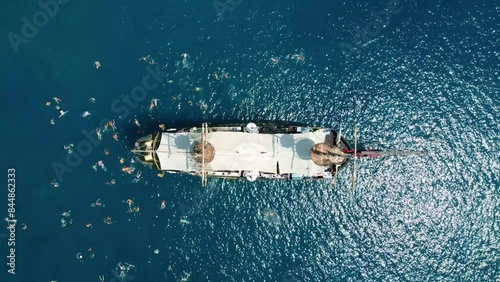 summer Wooden ship schooner and in tropics. A top drone view of wooden ship, boats, yachts. with swimming people, sea trip in the open air against blue sky. Turkey, Fethiye, Kemer