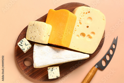 Wooden board with tasty che...