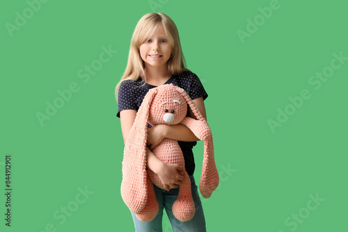Cute little girl with plush...