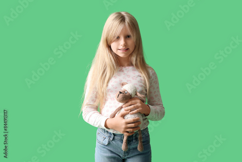 Cute little girl with plush...