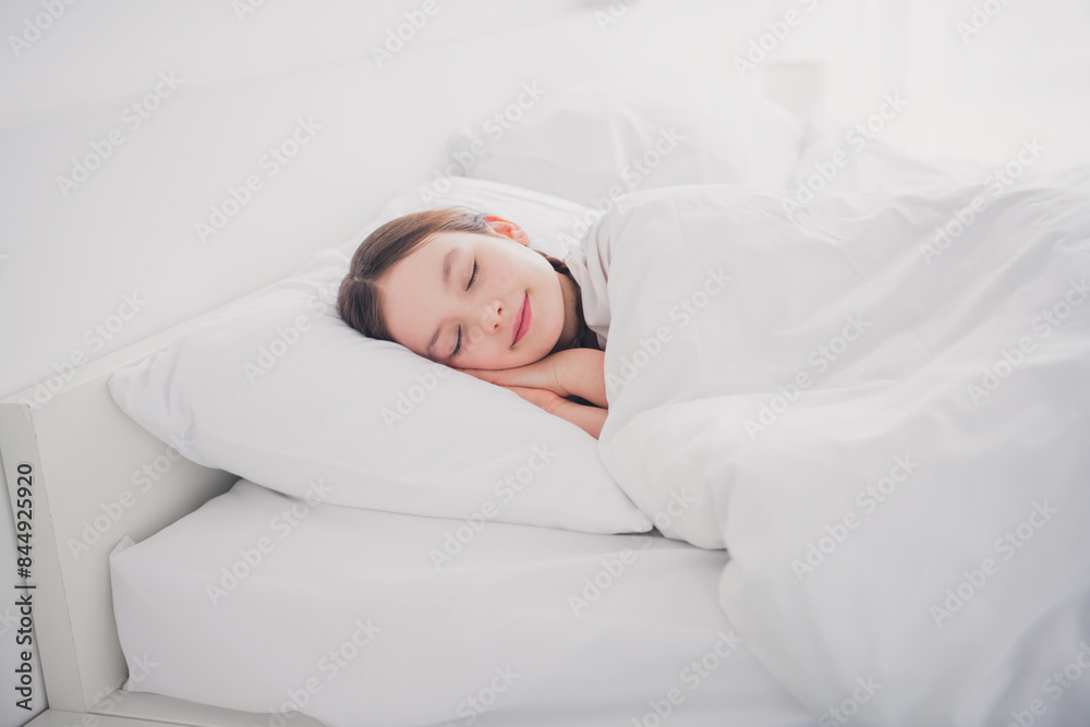 Portrait of charming cute adorable girl lying sleeping enjoying comfy bed sweet dreams white light room interior indoors Portrait of charming cute adorable girl lying sleeping enjoying comfy bed sweet dreams white light room interior indoors