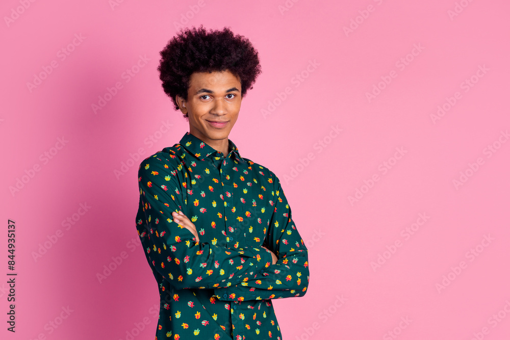 Portrait of confident cool cheerful guy with wavy hairstyle dressed print shirt holding arms crossed isolated on pink color background Portrait of confident cool cheerful guy with wavy hairstyle dressed print shirt holding arms crossed isolated on pink color background
