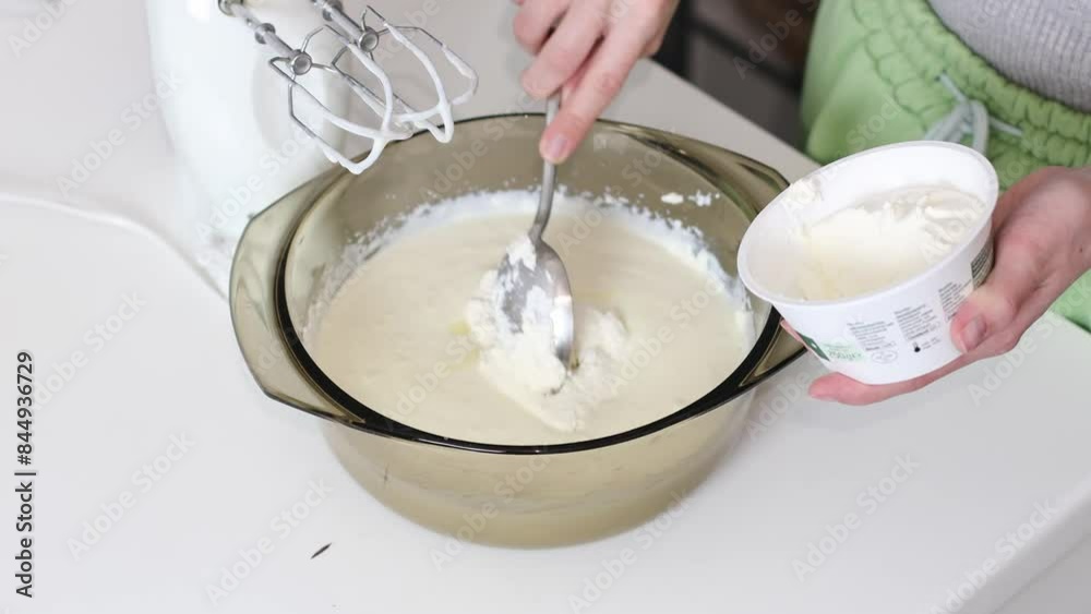 A young girl adds curd mass to cream in a bowl. Step 5 A young girl adds curd mass to cream in a bowl. Step 5