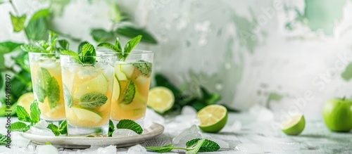 Refreshing Apple Mint Julep Served on a White Summer Table photo